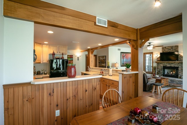81 Creekside Way Unit F/101, Burnsville, NC 28714 - dining space featuring a stone fireplace, ceiling fan, and recessed lighting