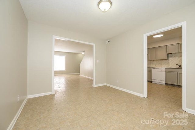 empty room with baseboards