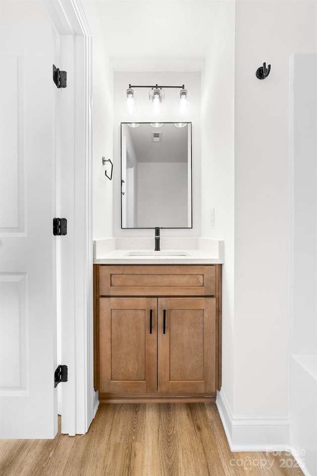 424 Airline Ave, Shelby, NC 28150 - bathroom with wood finished floors, vanity, and baseboards