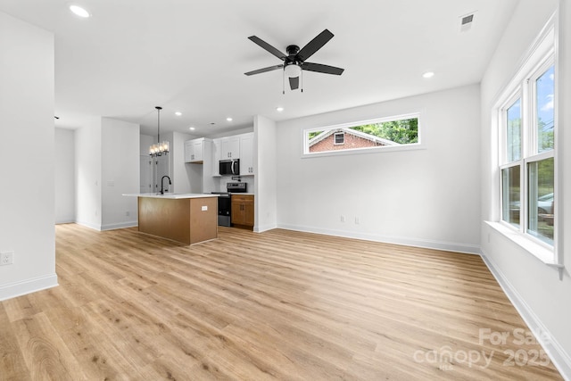 424 Airline Ave, Shelby, NC 28150 - kitchen featuring appliances with stainless steel finishes, open floor plan, light wood finished floors, recessed lighting, and a kitchen island with sink