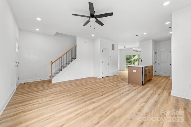 424 Airline Ave, Shelby, NC 28150 - unfurnished living room with stairs, recessed lighting, light wood-style flooring, a ceiling fan, and baseboards