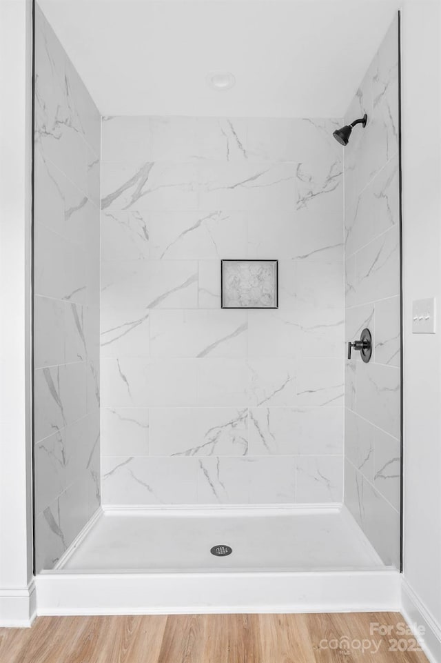424 Airline Ave, Shelby, NC 28150 - bathroom with a stall shower and wood finished floors