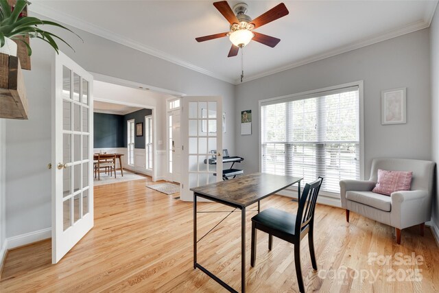 office featuring french doors, light wood finished floors, ornamental molding, ceiling fan, and baseboards
