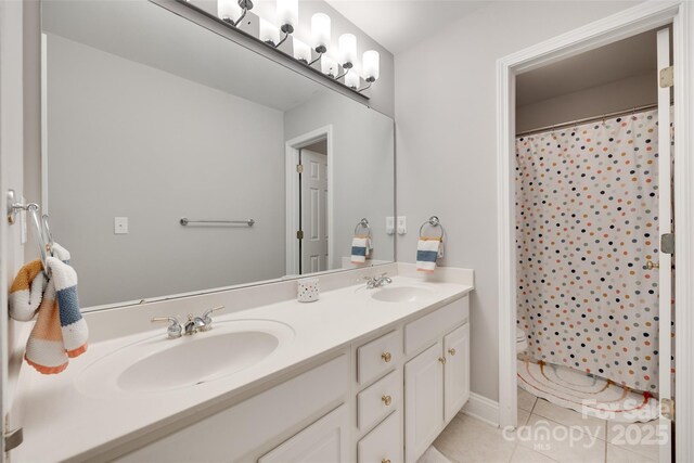 full bathroom with tile patterned flooring, double vanity, and curtained shower