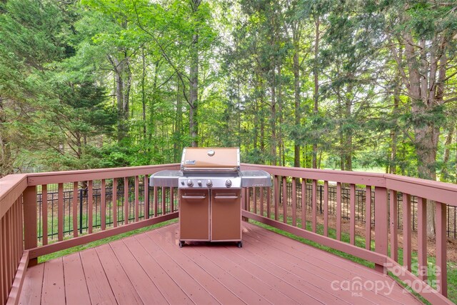 wooden deck featuring grilling area