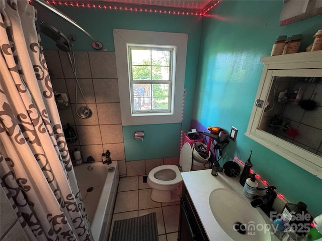 full bathroom featuring tile patterned flooring, shower / tub combo, vanity, and toilet