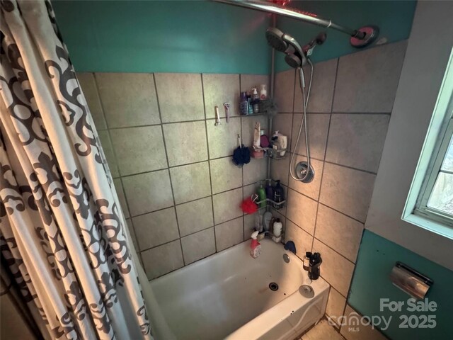 full bathroom with shower / bathtub combination with curtain