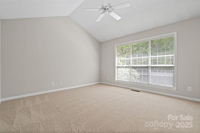 6434 Skyline Dr, Charlotte, NC 28269 - carpeted empty room featuring baseboards, lofted ceiling, and ceiling fan