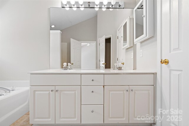 6434 Skyline Dr, Charlotte, NC 28269 - bathroom with double vanity and a bath