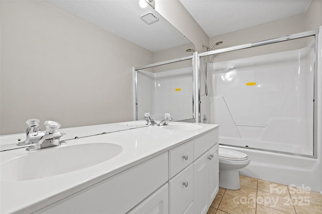 6434 Skyline Dr, Charlotte, NC 28269 - full bath featuring double vanity, toilet, bath / shower combo with glass door, and tile patterned flooring