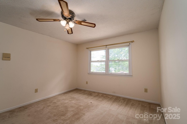 104 Ridge Dr, Stanley, NC 28164 - spare room featuring light colored carpet, ceiling fan, a textured ceiling, and baseboards