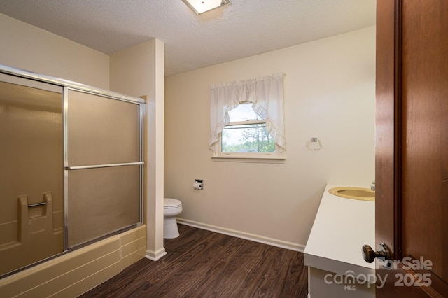 104 Ridge Dr, Stanley, NC 28164 - full bathroom with wood finished floors, toilet, vanity, a textured ceiling, and baseboards