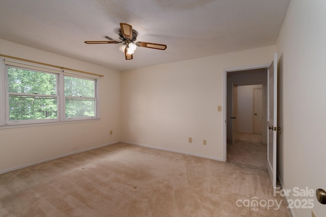 104 Ridge Dr, Stanley, NC 28164 - unfurnished room with light carpet, ceiling fan, baseboards, and a textured ceiling