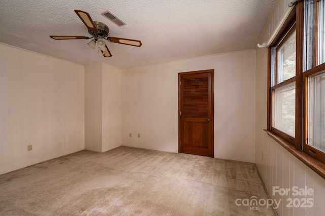 104 Ridge Dr, Stanley, NC 28164 - carpeted spare room featuring a ceiling fan and a textured ceiling