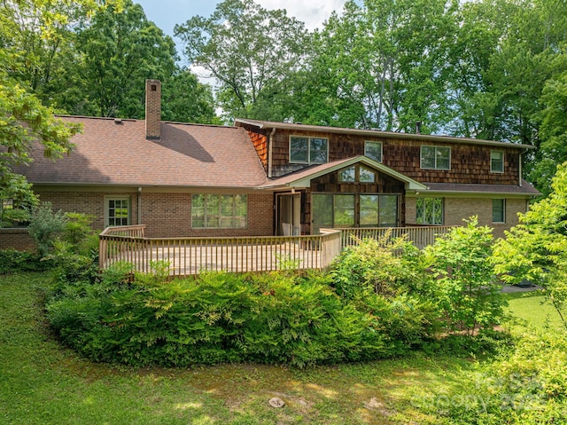 104 Ridge Dr, Stanley, NC 28164 - rear view of house featuring a deck, brick siding, and a chimney