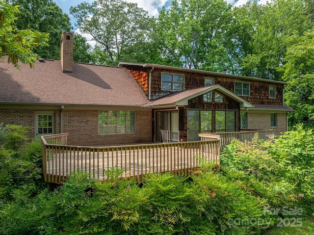 104 Ridge Dr, Stanley, NC 28164 - rear view of property with brick siding, a chimney, a wooden deck, and a shingled roof