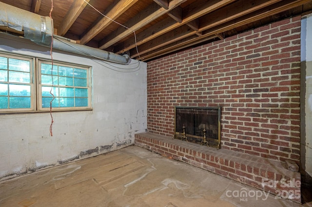 104 Ridge Dr, Stanley, NC 28164 - below grade area with a brick fireplace and concrete block wall