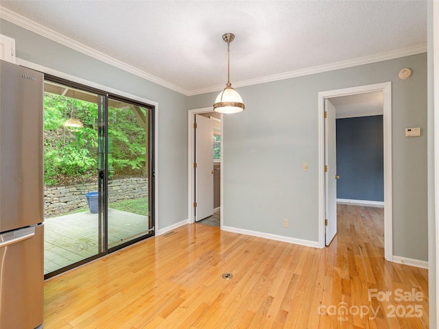 55 Willow Bnd, Hendersonville, NC 28792 - empty room with healthy amount of natural light, light wood-style floors, ornamental molding, and baseboards