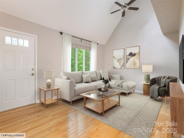 55 Willow Bnd, Hendersonville, NC 28792 - living area featuring high vaulted ceiling, hardwood / wood-style floors, a ceiling fan, and baseboards