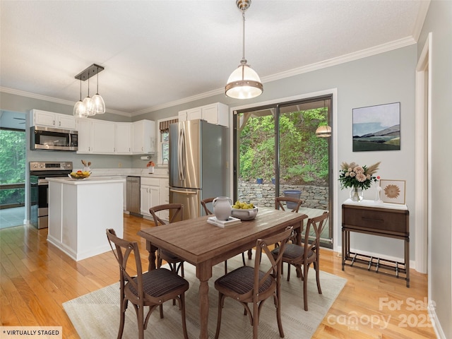 55 Willow Bnd, Hendersonville, NC 28792 - dining space with light wood-type flooring, crown molding, and baseboards