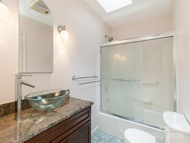 55 Willow Bnd, Hendersonville, NC 28792 - full bath featuring toilet, a skylight, vanity, crown molding, and shower / bath combination with glass door