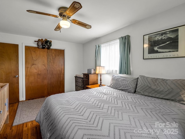 bedroom with wood finished floors and ceiling fan