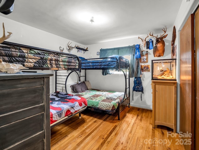 bedroom with light wood finished floors