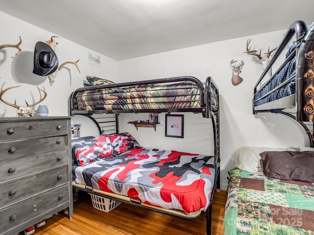 bedroom with wood finished floors