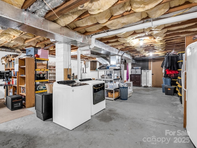 unfinished below grade area featuring washer and clothes dryer