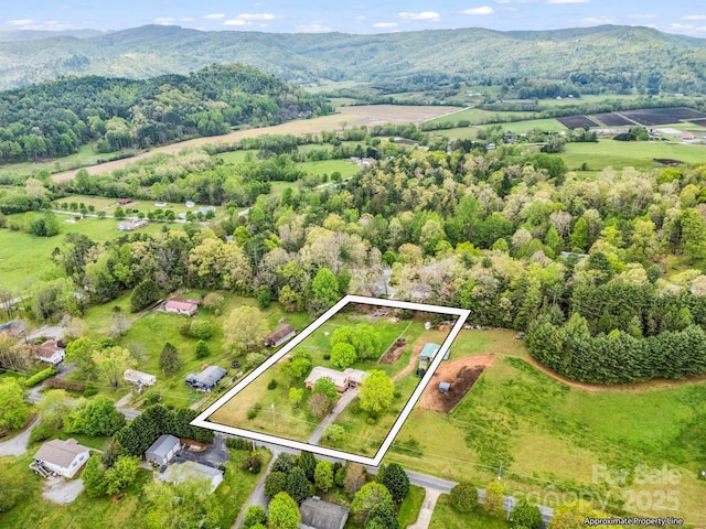 aerial overview of property's location with property boundaries highlighted and mountains