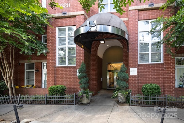 1320 Fillmore Ave Unit 426, Charlotte, NC 28203 - entrance to property featuring brick siding and fence