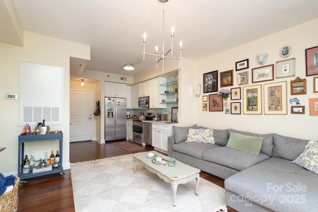 1320 Fillmore Ave Unit 426, Charlotte, NC 28203 - living area featuring dark wood-style flooring and a chandelier