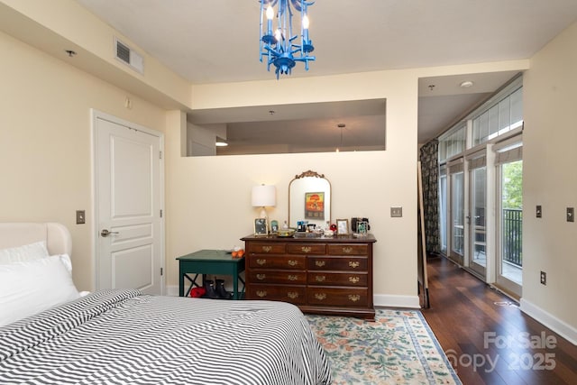 1320 Fillmore Ave Unit 426, Charlotte, NC 28203 - bedroom with access to exterior, wood finished floors, baseboards, and a chandelier