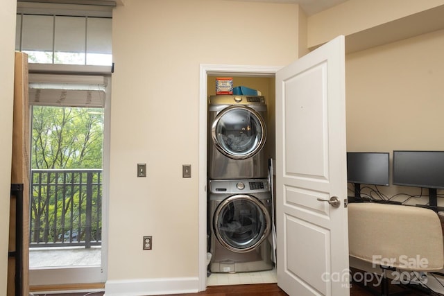 1320 Fillmore Ave Unit 426, Charlotte, NC 28203 - laundry room with stacked washer / drying machine and baseboards