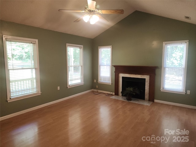4409 Homestead Rd, Rock Hill, SC 29732 - unfurnished living room featuring visible vents, a fireplace, light wood finished floors, vaulted ceiling, and a ceiling fan