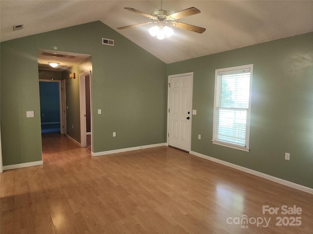 4409 Homestead Rd, Rock Hill, SC 29732 - spare room featuring wood finished floors, visible vents, lofted ceiling, and a ceiling fan