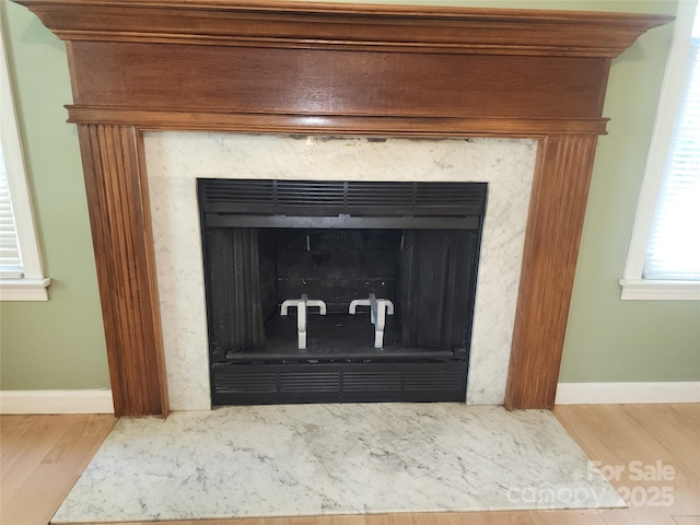 4409 Homestead Rd, Rock Hill, SC 29732 - details featuring baseboards, a high end fireplace, and wood finished floors