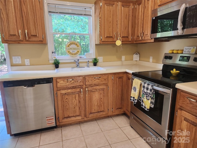 4409 Homestead Rd, Rock Hill, SC 29732 - kitchen with plenty of natural light, stainless steel appliances, brown cabinetry, and a sink