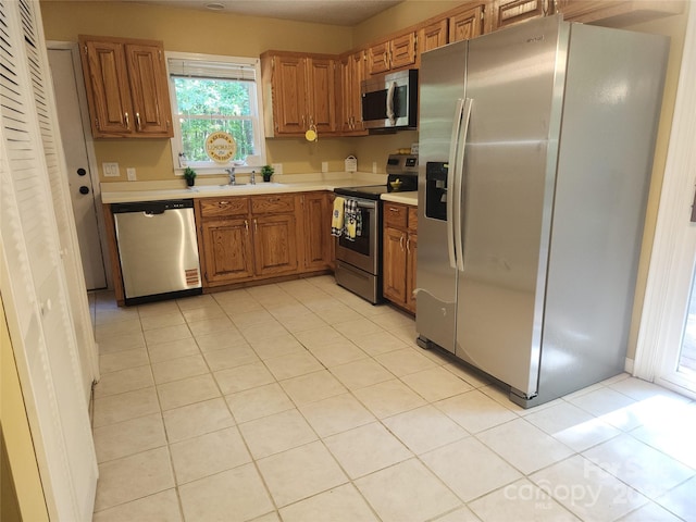 4409 Homestead Rd, Rock Hill, SC 29732 - kitchen with light countertops, appliances with stainless steel finishes, brown cabinets, and a sink