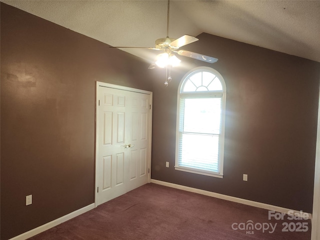 4409 Homestead Rd, Rock Hill, SC 29732 - unfurnished bedroom featuring a textured ceiling, carpet, vaulted ceiling, a ceiling fan, and baseboards