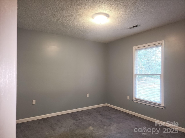 4409 Homestead Rd, Rock Hill, SC 29732 - spare room with a textured ceiling, dark colored carpet, baseboards, and visible vents