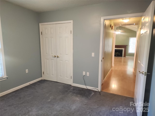 4409 Homestead Rd, Rock Hill, SC 29732 - unfurnished bedroom featuring a closet, baseboards, a fireplace, and carpet floors