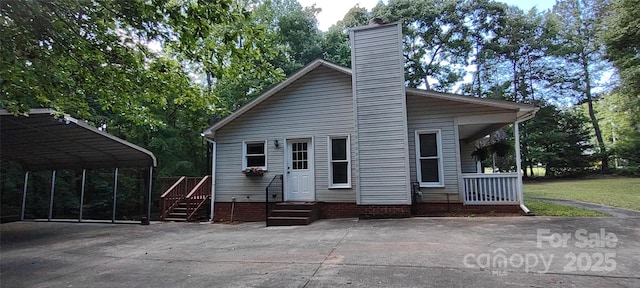 4409 Homestead Rd, Rock Hill, SC 29732 - back of property featuring driveway, a chimney, and a carport