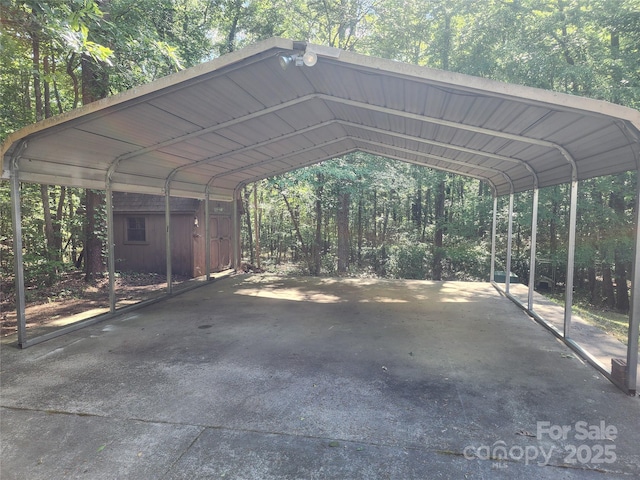 4409 Homestead Rd, Rock Hill, SC 29732 - view of car parking featuring a detached carport and a view of trees