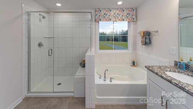 full bath with vanity, recessed lighting, a bath, and a stall shower