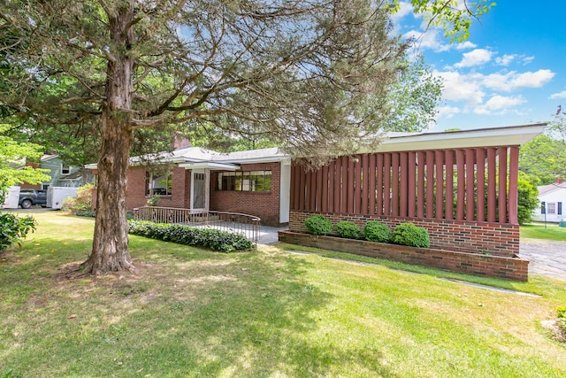 1102 E 13th St, Kannapolis, NC 28083 - view of front of house featuring brick siding and a front lawn