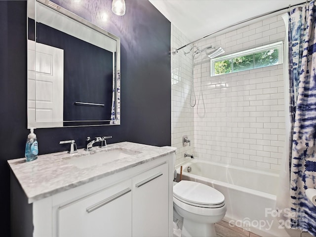 bathroom with shower / bathtub combination with curtain, toilet, and vanity