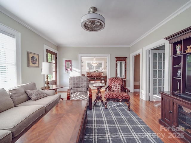907 Edgewood Cir, Gastonia, NC 28052 - living room featuring ornamental molding, a chandelier, and wood finished floors