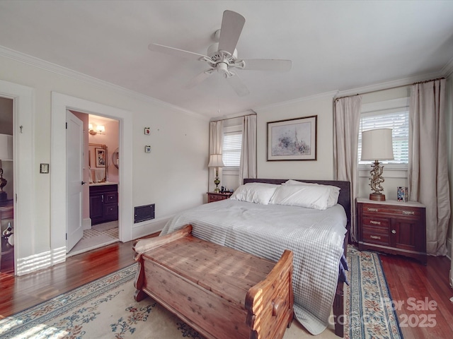 907 Edgewood Cir, Gastonia, NC 28052 - bedroom with wood finished floors, crown molding, multiple windows, and ensuite bathroom