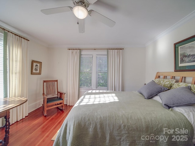 907 Edgewood Cir, Gastonia, NC 28052 - bedroom with crown molding, wood finished floors, a ceiling fan, and baseboards
